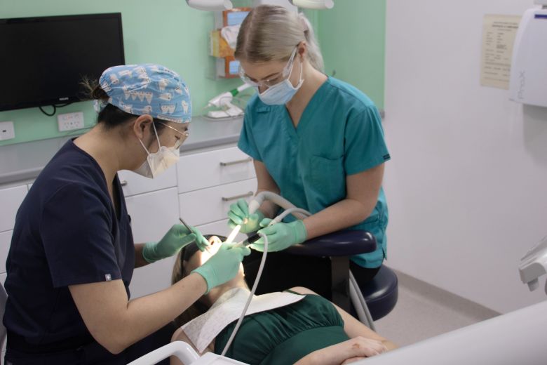 dentist and nurse performing tooth extractions on a patient in northam
